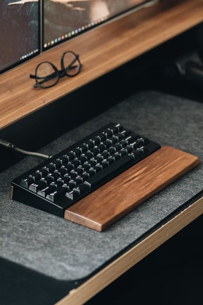 a keyboard with a wooden hand rest
